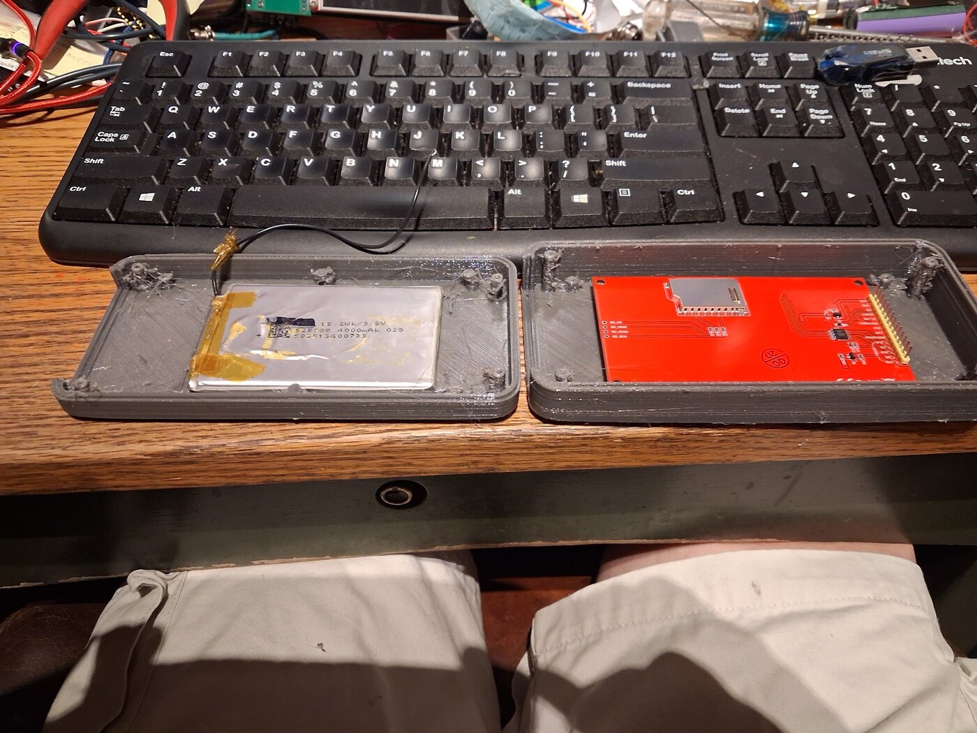 Full-size printed VectorTrim enclosure fit check with flat battery and TFT placed in the two case halves